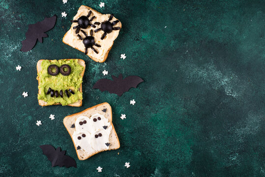 Halloween food for children. Funny scary monsters toasts