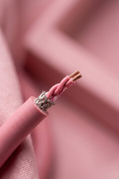 Close-up of a shielded twisted pair cable with exposed copper wires