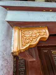 Ornate wooden corbel with carved floral pattern © IbragimovN