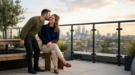 Fototapeta premium Romantic couple on a rooftop terrace with city skyline view. Man kissing smiling woman on the cheek at sunset. Urban lifestyle and dating concept