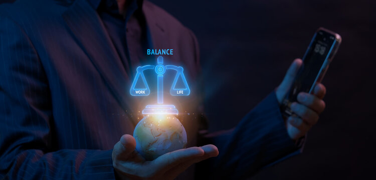 Businessman holding smartphone while supporting world globe with glowing balance scale displaying Work and Life text labels. Global Work Life Balance harmony and employee lifestyle wellness concept.
