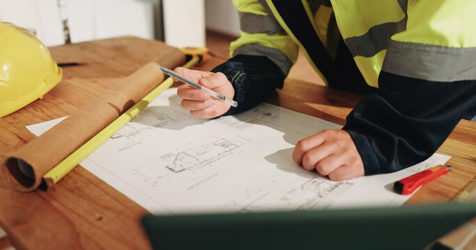 Architecture, blueprint and hands of person for renovation, property planning or building layout. Construction, paper and worker with sketch, floorplan and drawing for design, remodeling or structure