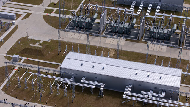 Aerial view of the Baltica 2 Onshore Substation featuring large electrical transformers, metal power infrastructure, and complex wiring in Choczewo, Poland.