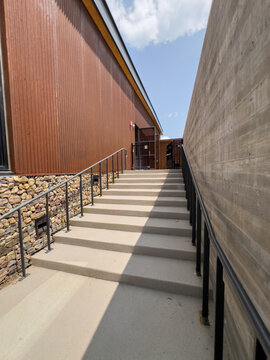 Outdoor Concrete Staircase with Black Metal Railings