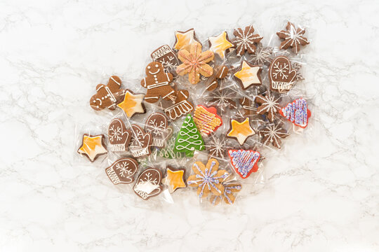 Assorted decorated gingerbread cookies on marble background