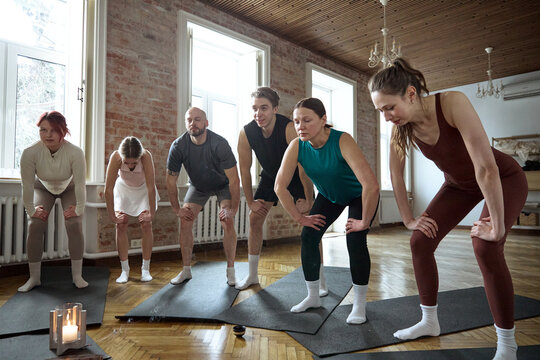Yoga class doing yoga in a group mindfulness workshop at a yoga studio