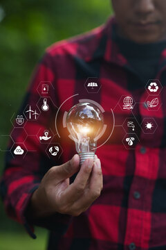 Blazing Light Bulb with Renewable Energy Icons"