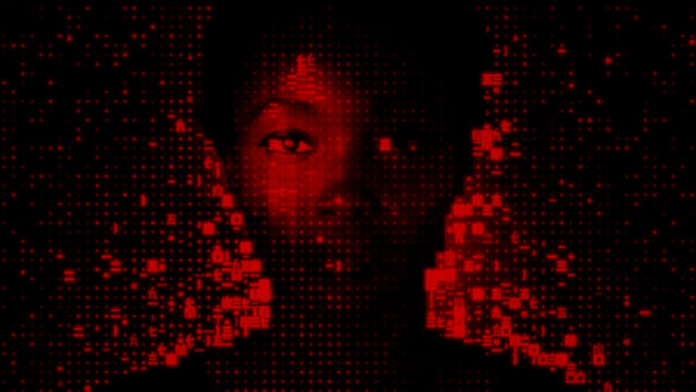 Woman's Face dissolving into Machine Code. Stolen Personal Data Concept.