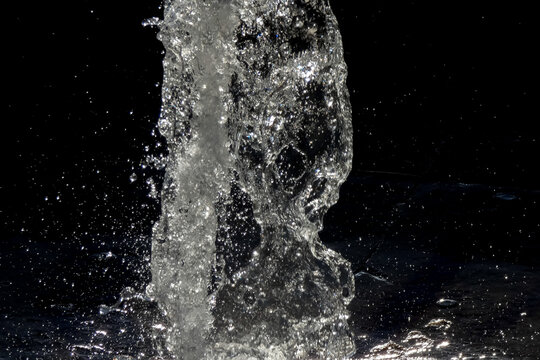 Sparkling water fountain splashing in urban setting