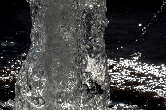 Sparkling water fountain splashing in urban setting