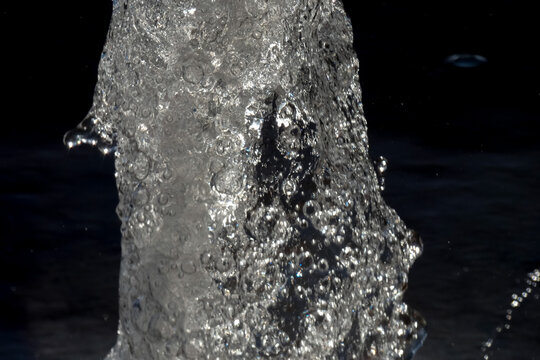 Sparkling water fountain splashing in urban setting