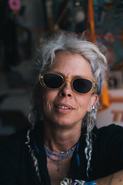 Confident stylish woman with gray hair and sunglasses