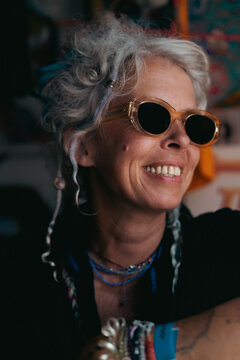 Stylish mature woman with grey hair and sunglasses