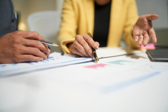 Business team reviewing charts in meeting