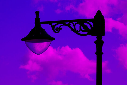 Malta street lamps silhouetted against blue hour sky