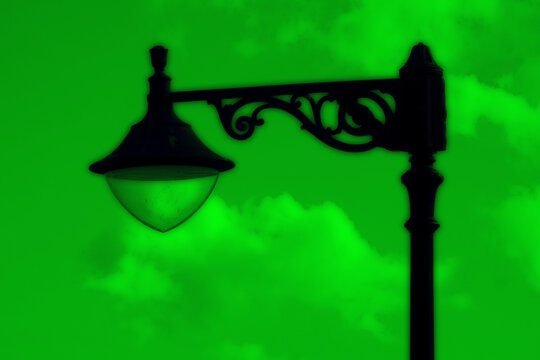 Malta street lamps silhouetted against blue hour sky