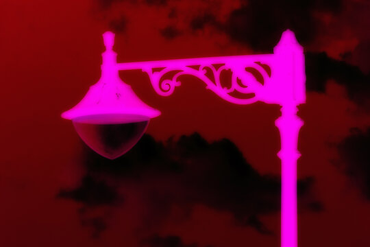 Malta street lamps silhouetted against blue hour sky