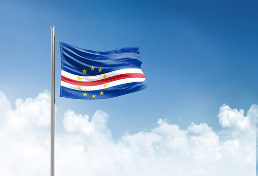 Cabo Verde flag waving in beautiful sky.