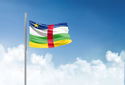 Central African Republic flag waving in beautiful sky.