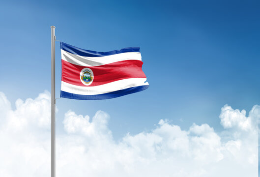 Costa Rica flag waving in beautiful sky.
