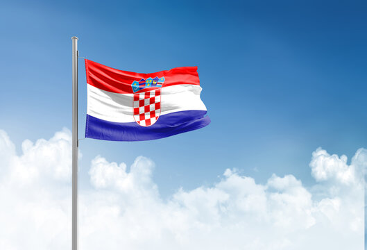 Croatia flag waving in beautiful sky.