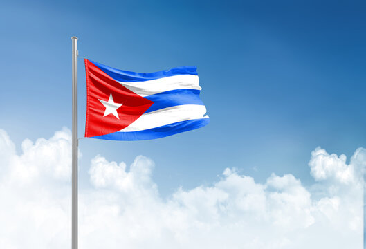 Cuba flag waving in beautiful sky.