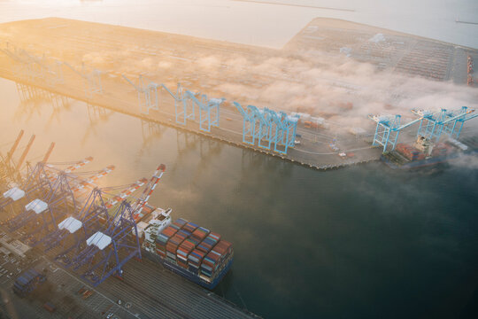 An aerial view of cargo port operations with container cranes in Long