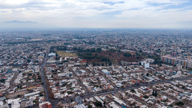 Aerial view of Parque de Mayo surrounded by the urban grid, residential buildings, and streets of San Juan, San Juan, Argentina.