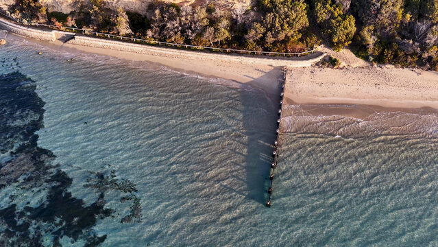 Aerial View of Rye Beach with Wooden Groyne and Clear Water