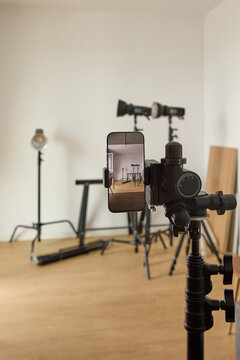 Smartphone Mounted on Tripod for Video Recording in Studio Setup