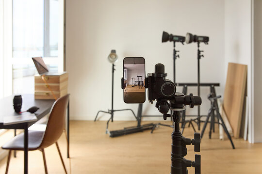 Smartphone on Tripod in Modern Photography and Video Studio