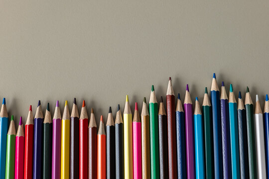 Colorful Pencils Form an Uneven Row Beneath Generous Copy Space