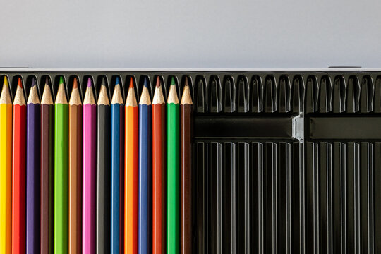 Colorful Pencils Fill Half of an Open Black Case