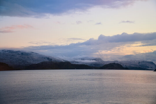 Soft twilight over a Nordic fjord and mountain landscape