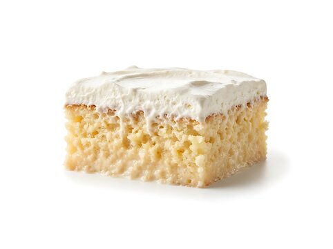 Single slice of moist Tres Leches cake with whipped cream topping on white background