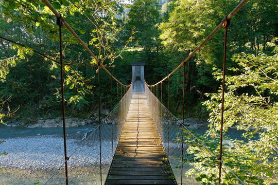 Austria, Vorarlberg, View of rope bridge over Bolgenach creek