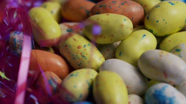 Macro shot of speckled easter egg candies in tinsel