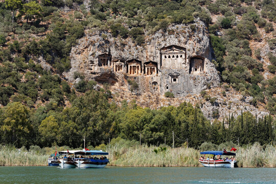 Turkey, Dalyan, Tourboats at Lycian Rock Tombs of Kaunos