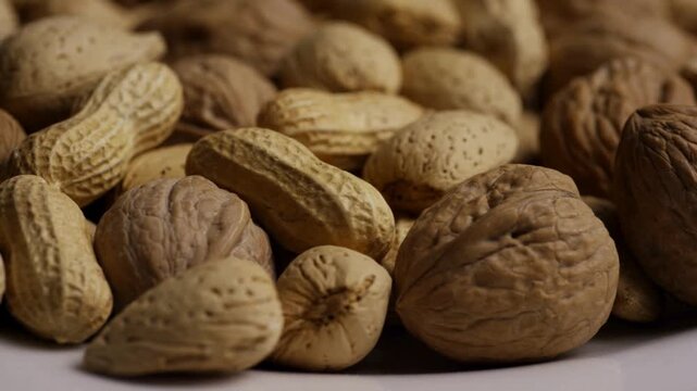Assortment of walnuts almonds and peanuts in their shells