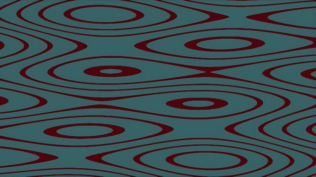 Textured patterned fabric surface displays abstract wavy organic shapes in teal and maroon design creating a dynamic background