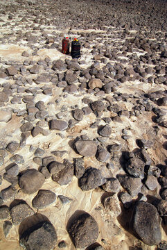 Djibouti, Balho, two containers of water in the middle of rocky desert