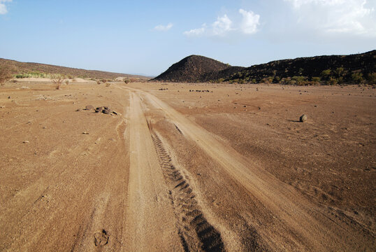 Djibouti, Inland, dusty road through the arid desert