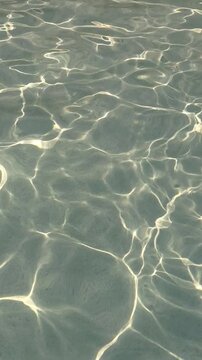 Water surface reflects light in a pool on a sunny day