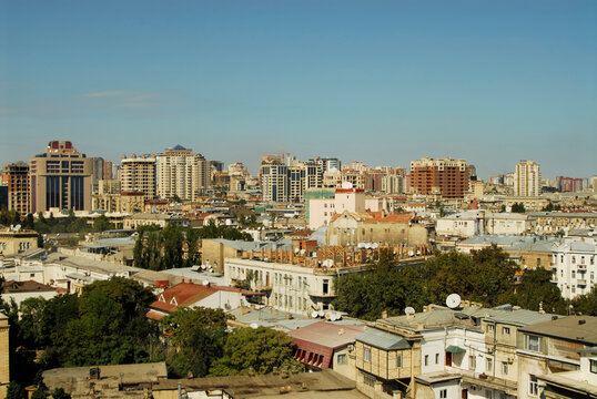 Azerbaijan, Baku, view of from  Old Maiden Tower of houses congested against cloudy sky