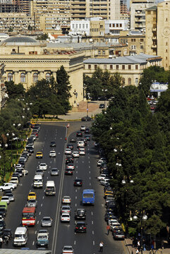 Azerbaijan, Baku, view  from  Old Maiden Tower of buildings and road with vehicles in traffic