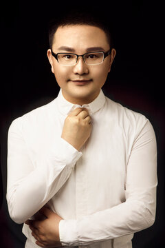 portrait of a handsome young man in glasses