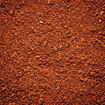 Granular red earth laterite soil texture for website backgrounds, 3D environment mapping, and architectural visualization projects.