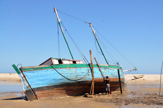 Madagascar, Morondava, Fisherman boat at sea at low tide
