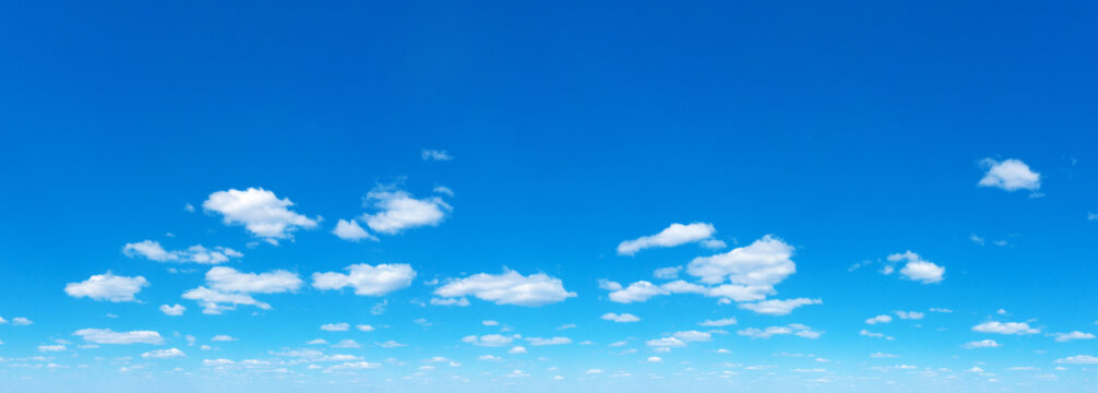 Panoramic fluffy cloud in the blue sky. Sky with cloud on a sunny day.