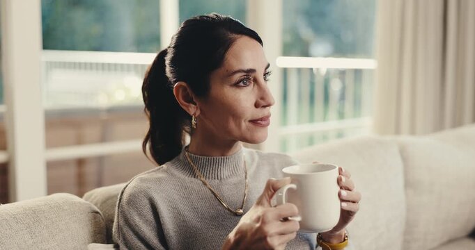Relax, thinking and woman in house with coffee, calm mindset and daydreaming on weekend break. Reflection, nostalgia and mature person with warm drink, mindfulness and peaceful perspective in lounge.
